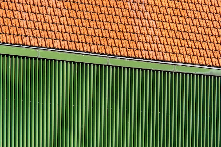 Side-by-side Adelaide roofs — Colorbond on the left, terracotta tile on the right