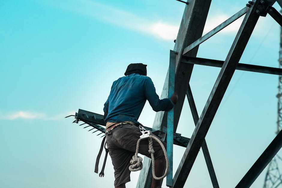 Roofer with proper harness and fall arrest equipment safely walking on Adelaide tile roof