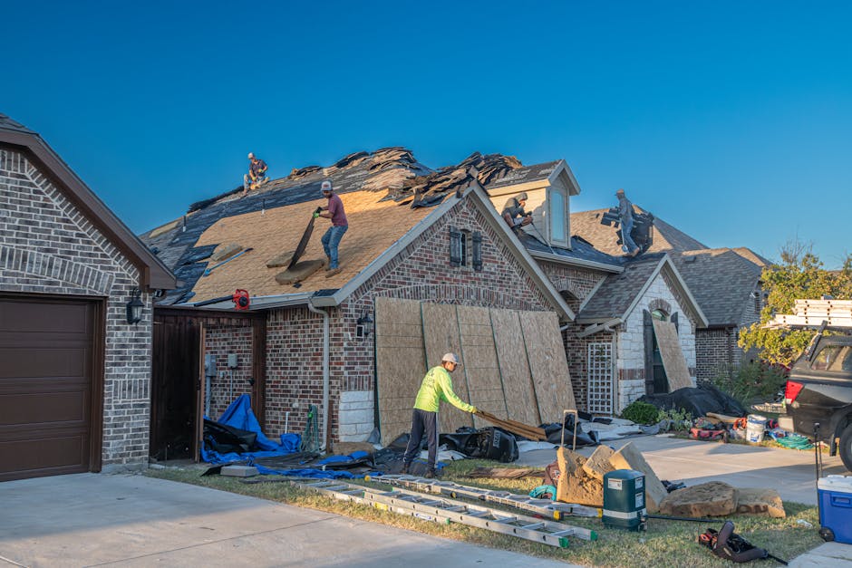Adelaide roof leak repair — licensed roofer photographing source of water entry above ceiling stain