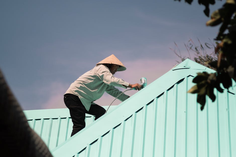 Adelaide tile roof half restored — left side new acrylic membrane coating, right side original weathered tiles