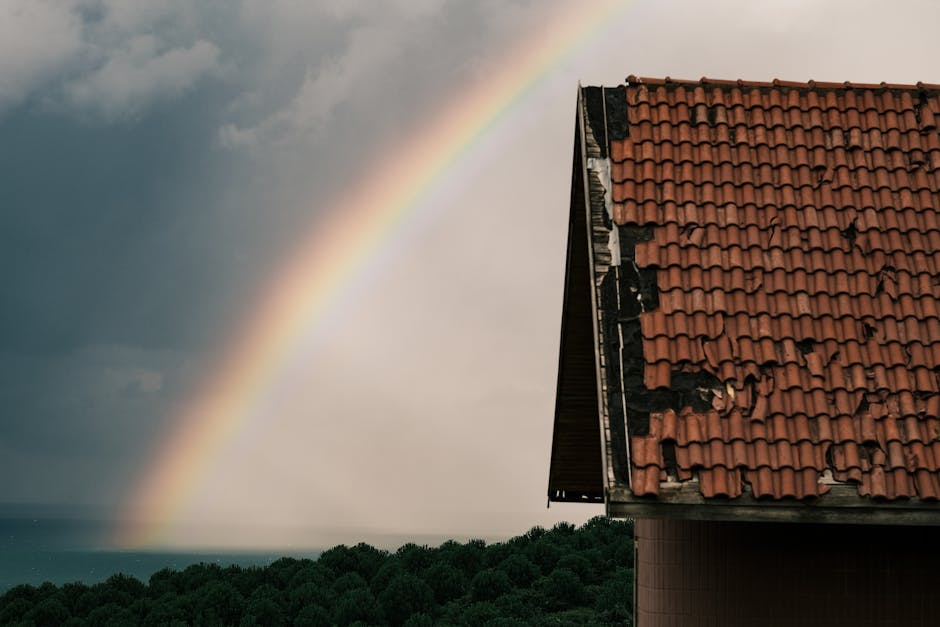Adelaide home after storm with visible roof damage — broken tiles and lifted Colorbond sheet